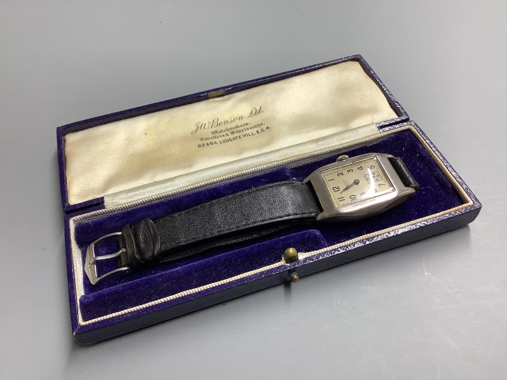 A gentleman's 1930's silver J.W. Benson manual wind wrist watch, on a leather strap.